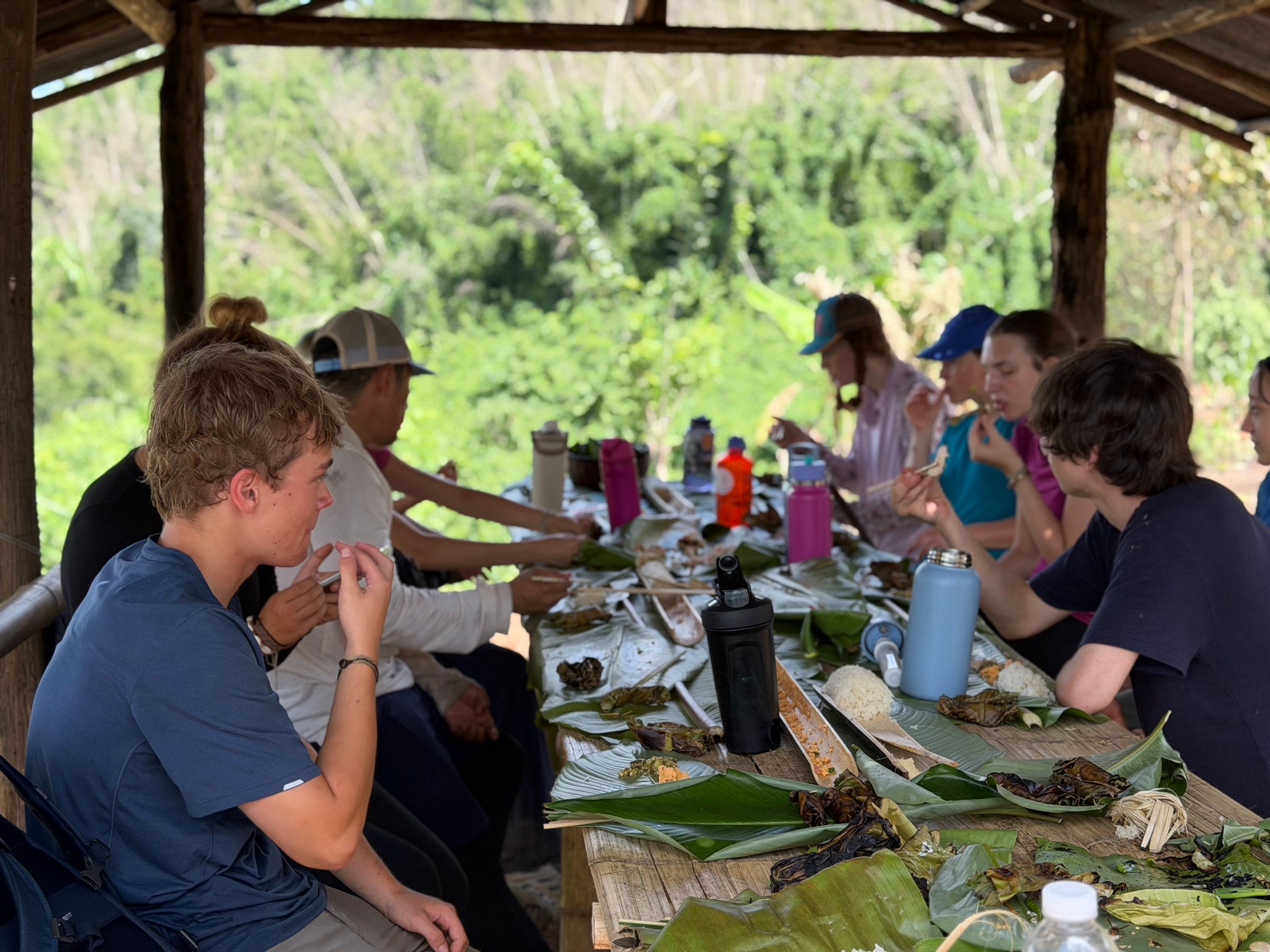 Students enjoying a meal at a service learning project