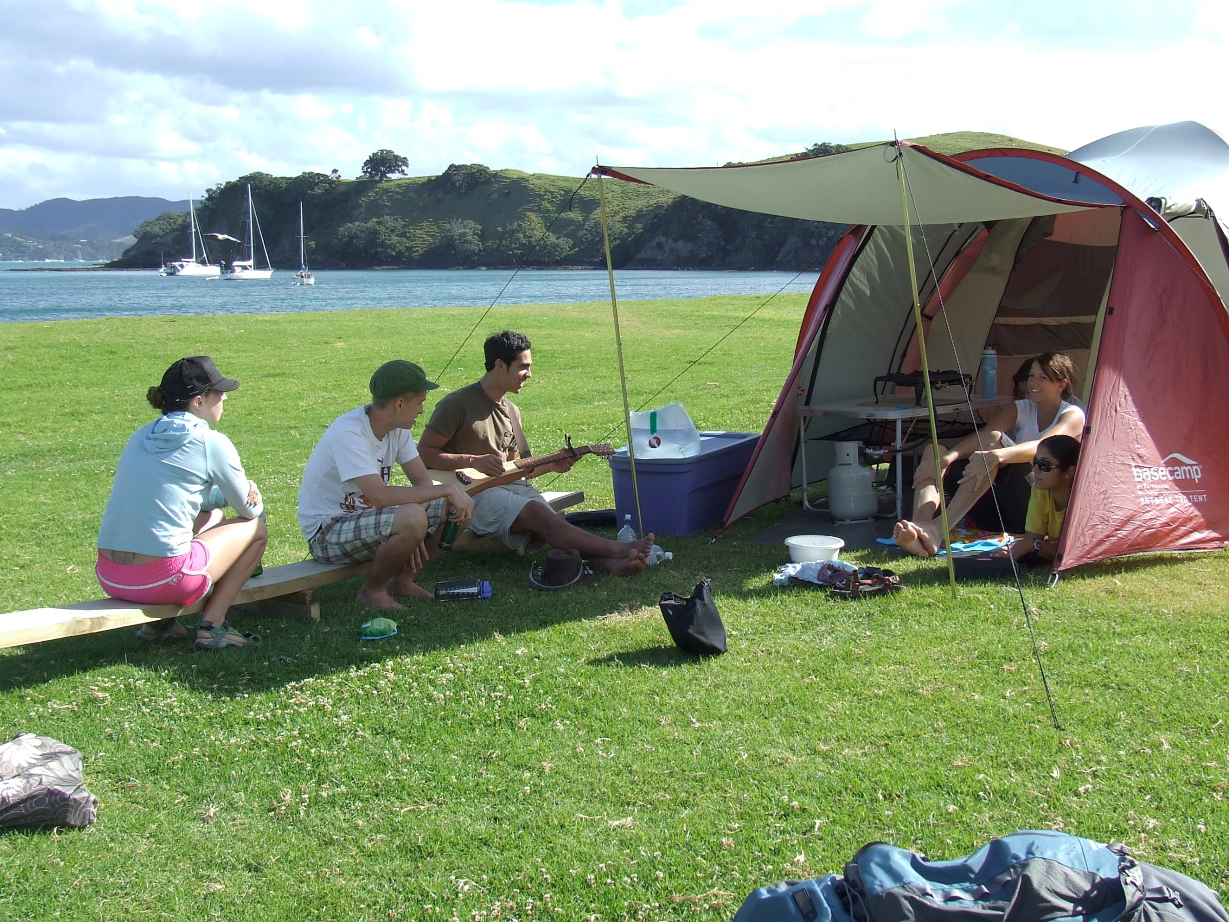 Students camping and talking in New Zealand