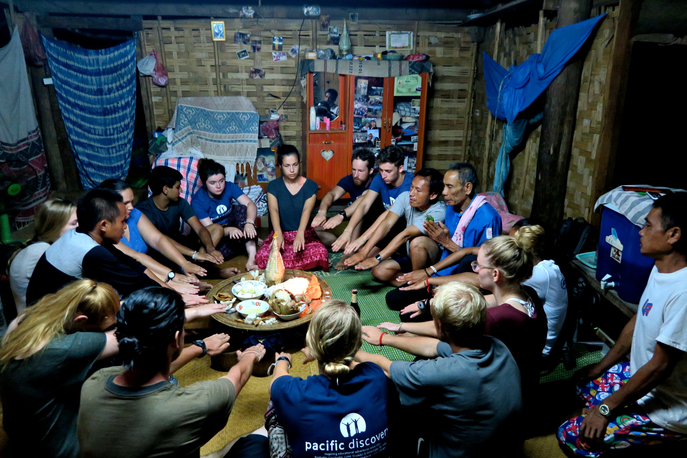Students eating at a guesthouse in Southeast Asia