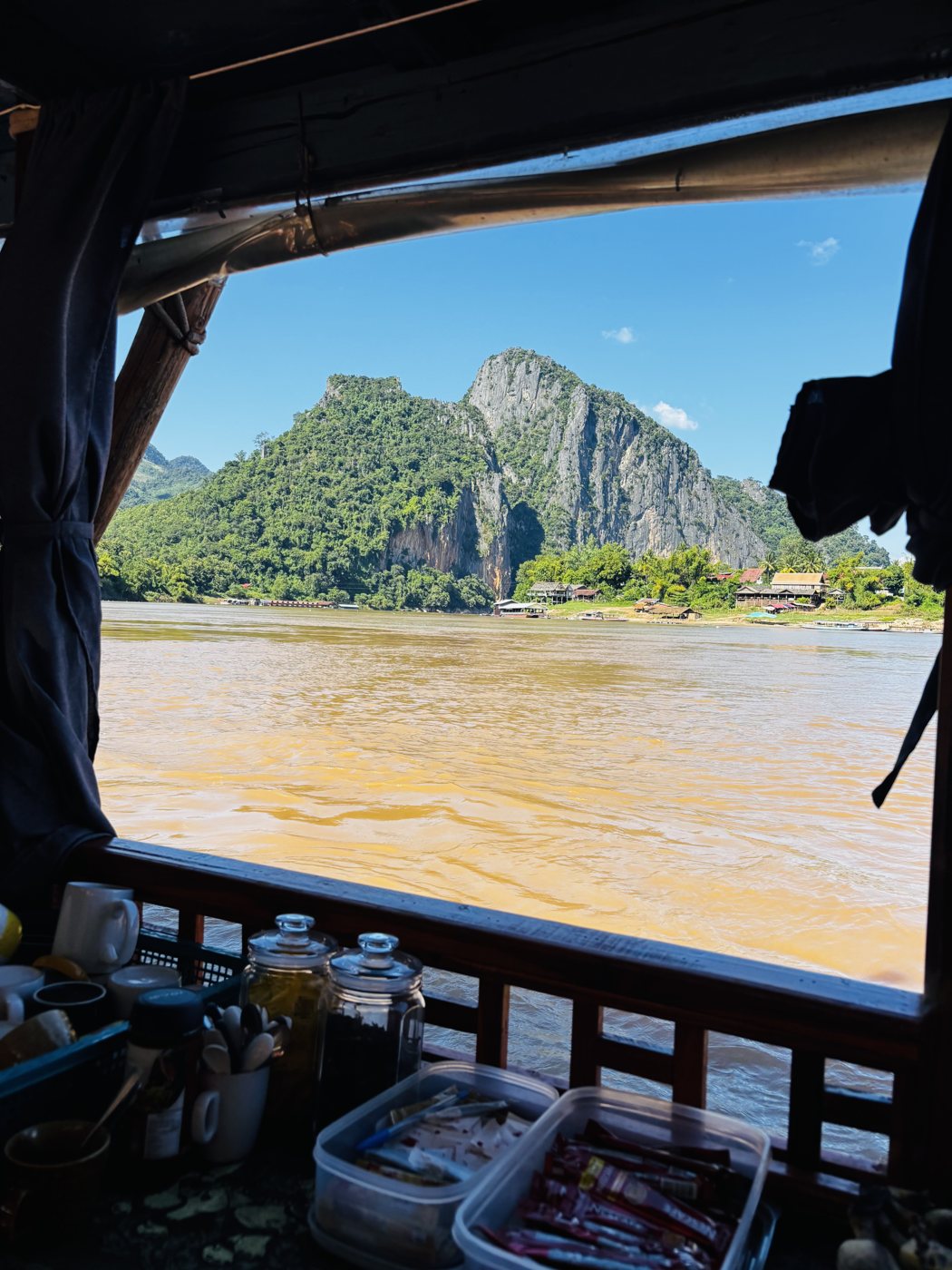 View of limestone cliffs from a slow boat on the Mekong